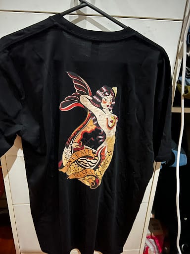 Black custom printed t-shirt with traditional tattoo mermaid graphic on back